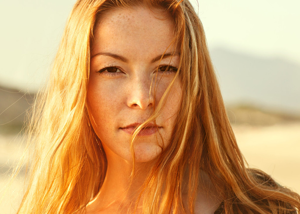 Portrait of red-haired girl walking on the sea, vogue - Φωτογραφία, εικόνα