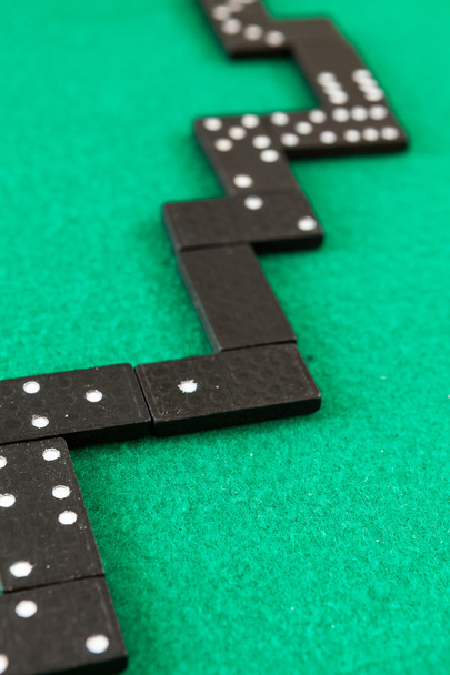 Dominoes on a green background - Photo, Image