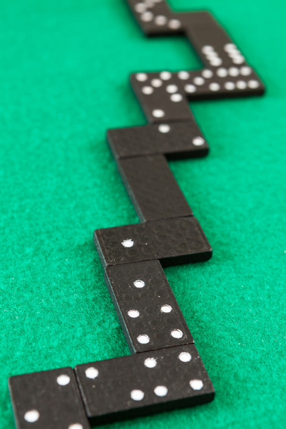 Dominoes on a green background - Photo, Image