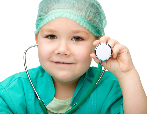Little girl is playing doctor with stethoscope - Φωτογραφία, εικόνα