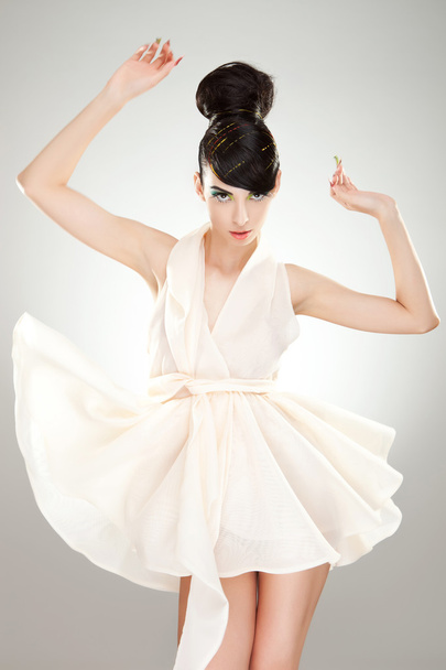 Luxurious young woman in light flying dress - Photo, Image