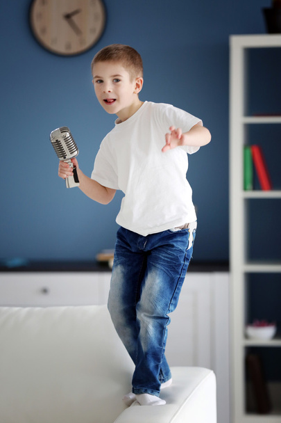 Little boy with microphone   - Foto, afbeelding