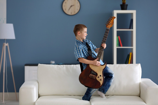 boy playing guitar   - Фото, изображение