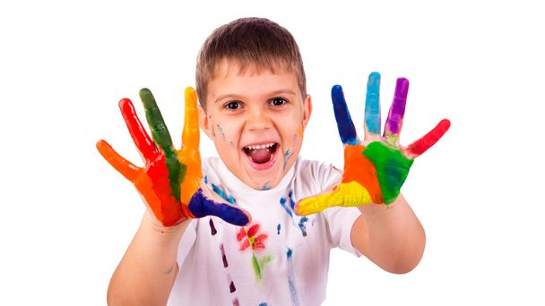 Little boy with hands painted in colorful paints ready for hand prints - Foto, imagen