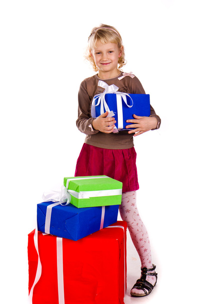 Beautiful little girl with presents - Foto, Imagen