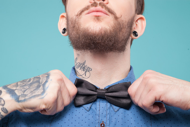 Cheerful young hipster is wearing a tie - Foto, Imagem