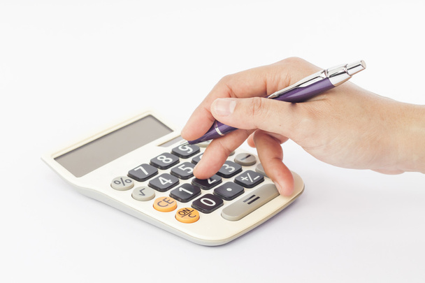 Calculator met hand geïsoleerd op witte achtergrond - Foto, afbeelding