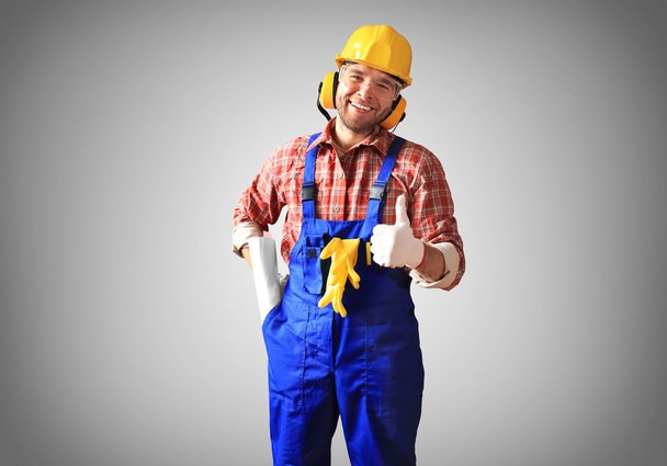 Builder in yellow helmet - Фото, зображення