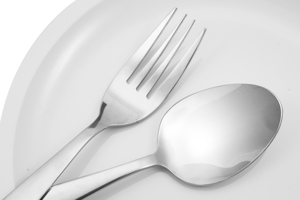 Fork and spoon on a plate with napkin - Foto, Imagem