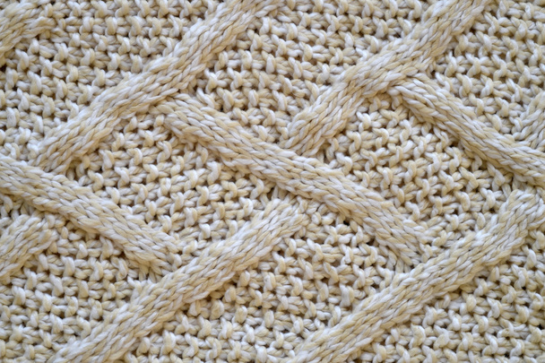 Texture of a knitted beige textile - Photo, Image