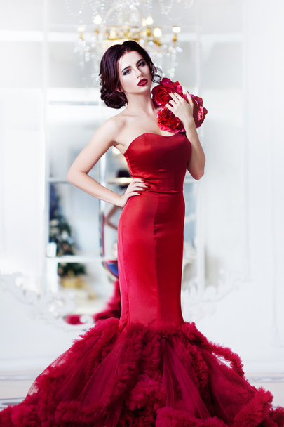 Beauty Brunette model woman in  evening red dress. Beautiful fashion luxury makeup and hairstyle,   full length - Fotó, kép