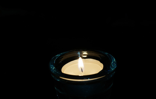 burning candle isolated on black. - Photo, Image