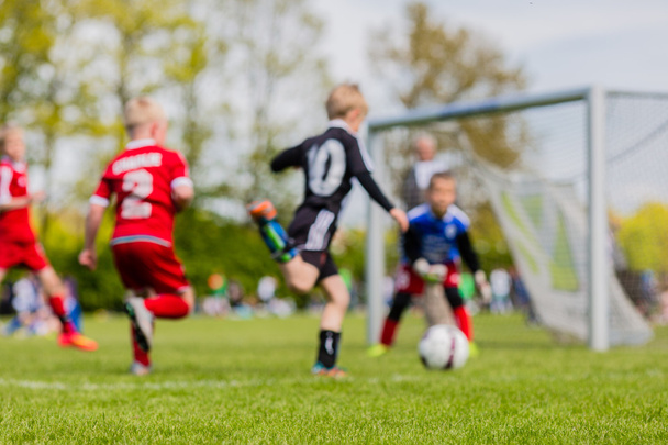Blurred kids playing soccer match - Foto, immagini