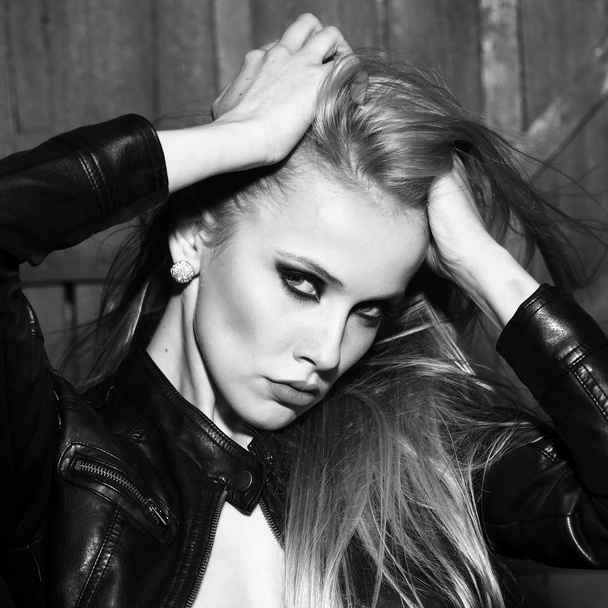 Sexual woman in leather jacket - 写真・画像