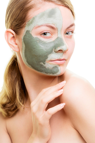 Woman in clay mud mask on face - Valokuva, kuva