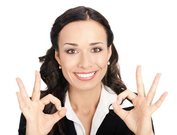 Businesswoman with okay gesture, on white - Foto, Bild