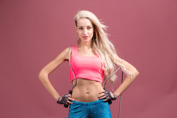 Portrait of young and healthy blonde with skipping rope - Fotoğraf, Görsel