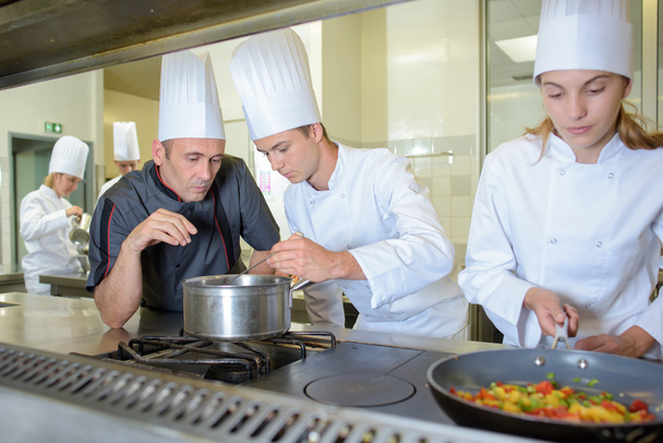 Chef checking work of trainee cooks - Zdjęcie, obraz