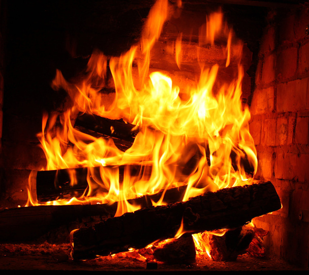 Fire in burning fireplace in winter close-up - Photo, Image
