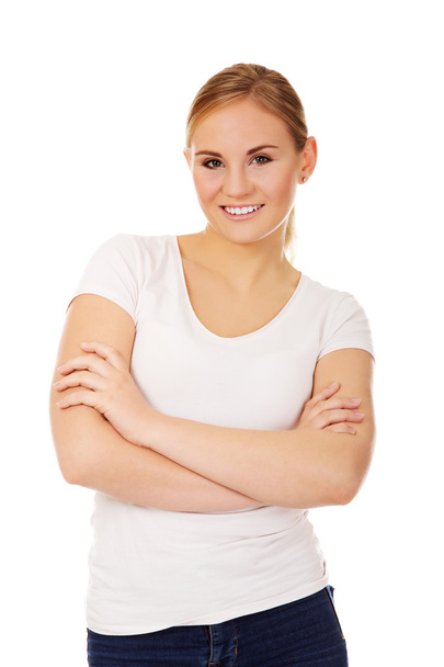 Happy young woman wiyh folded arms - Foto, Imagen