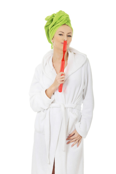 Beautiful woman with oversized toothbrush. - Foto, imagen