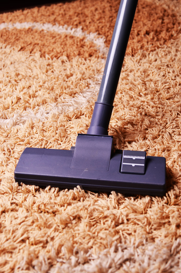 vacuum cleaner on the carpet - Фото, зображення