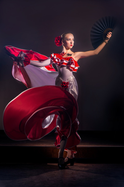 Woman dancing in red dress - Fotoğraf, Görsel