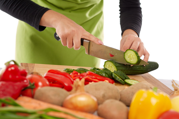 Woman chopping vegetables - Фото, зображення