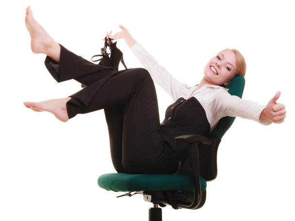 Businesswoman relaxing on chair. - Zdjęcie, obraz