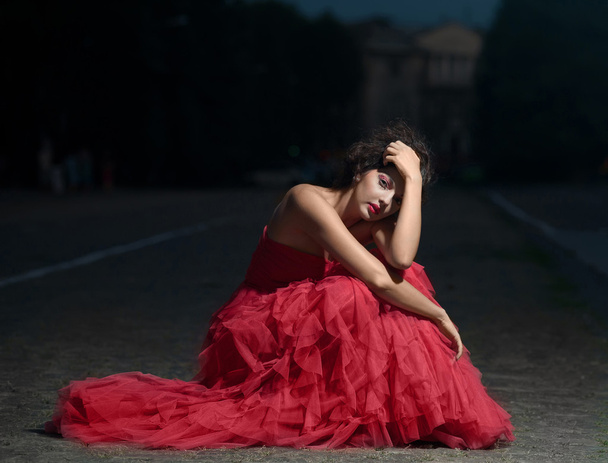 Beautiful woman in red dress - Фото, зображення