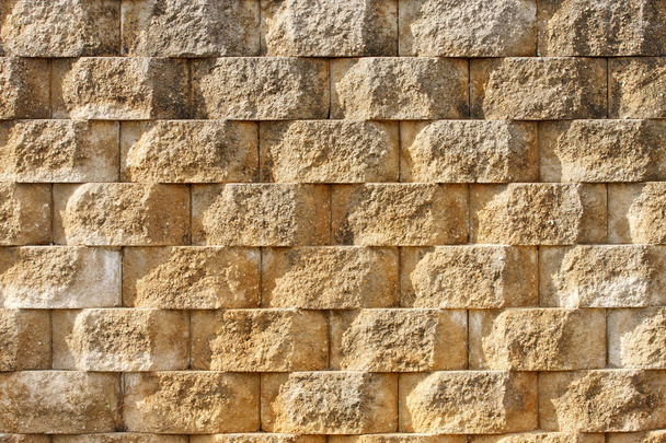 Textured Interlocking Block Wall in Morning Light - Photo, Image
