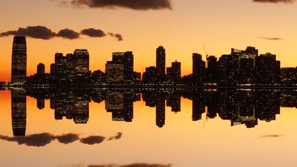 skyline silhouette reflecting in water - Footage, Video