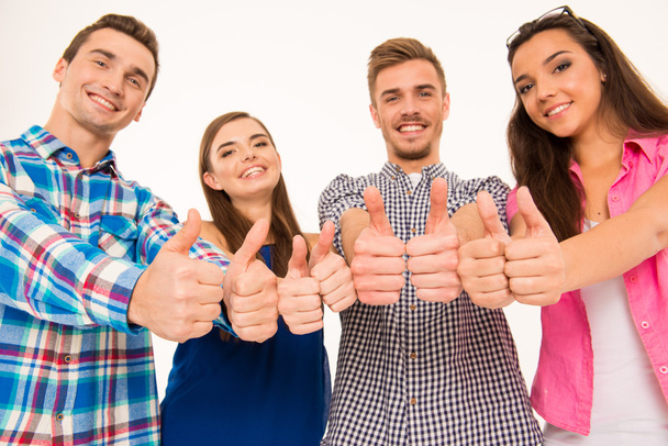 Happy cheerful  group showing thumbs up - Фото, изображение