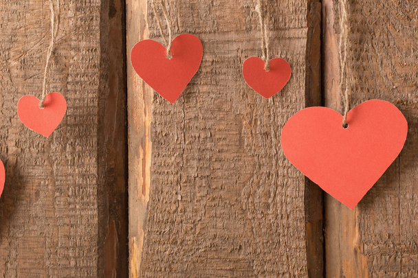 vintage red hearts on wooden background - Fotografie, Obrázek