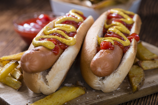 Hot Dogs with ketchup and mustard - 写真・画像