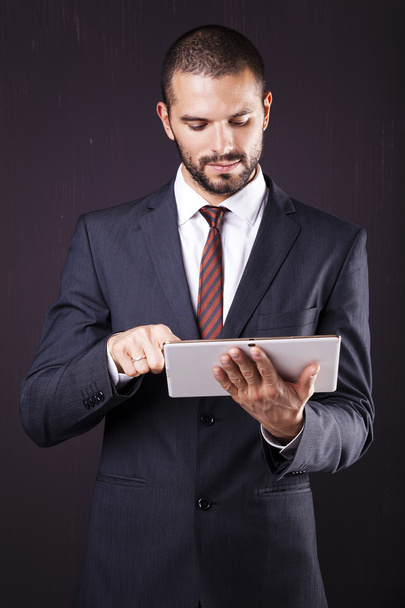 Executive man using a digital tablet - Zdjęcie, obraz