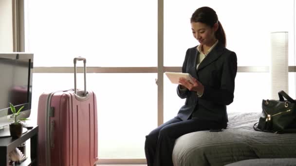 Work Asian Manager Woman Businessswoman Ipad Tablet In Hotel Room - Felvétel, videó
