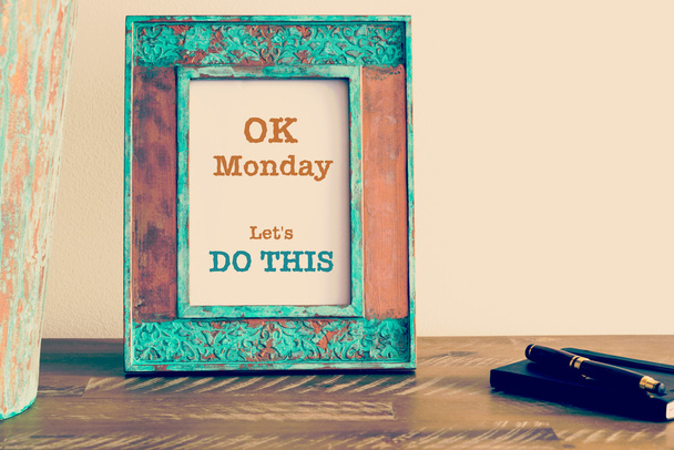 Motivational quote written on vintage photo frame OK MONDAY LET'S DO THIS - 写真・画像