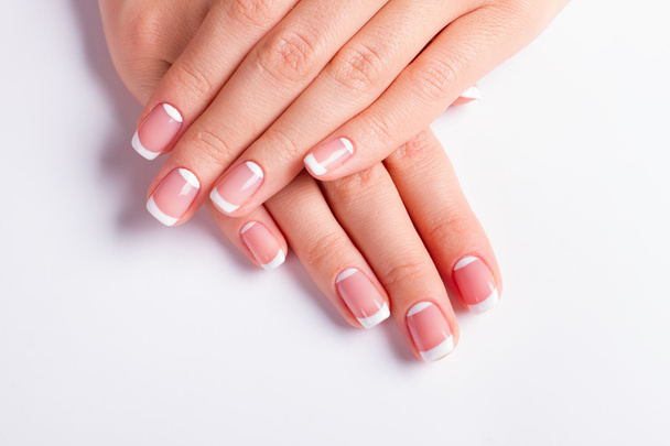 Neat manicure on a white background. - Photo, Image