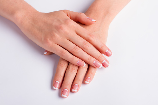 Woman's manicure on a white background. - Foto, Imagen