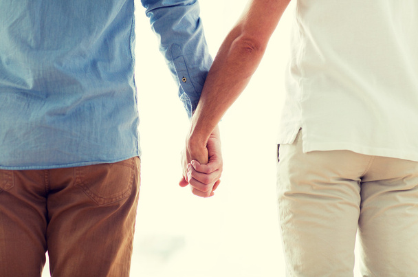 close up of happy male gay couple holding hands - Fotoğraf, Görsel