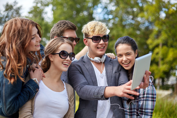 students or teenagers with tablet pc taking selfie - Fotó, kép