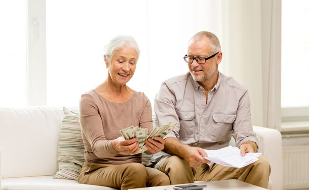 senior couple with money and calculator at home - Fotoğraf, Görsel