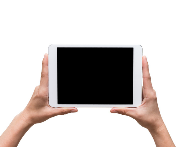 mains féminines tenant un gadget tablette tactile sur bac blanc
 - Photo, image