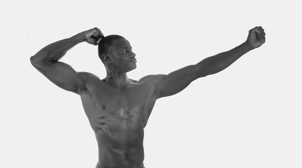 Svalnatý černý atlet, bílé pozadí - Fotografie, Obrázek