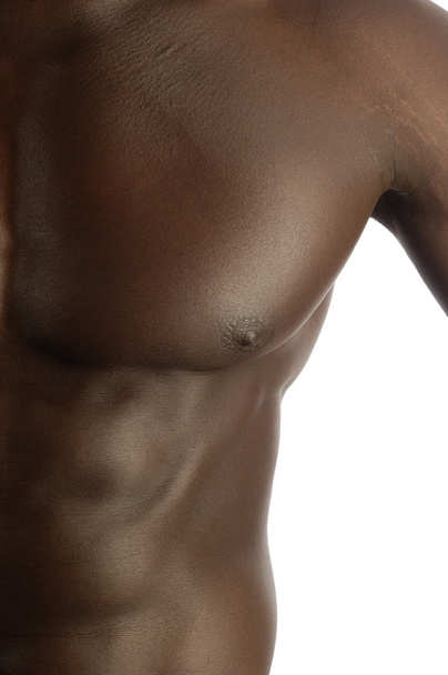 pectoral muscle of a black man with a muscular body, white backg - Foto, Imagem
