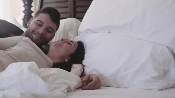 Attractive couple kissing waking up - Footage, Video