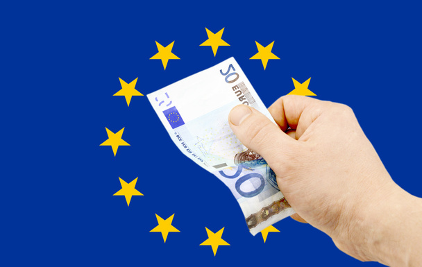 Bankbiljet in denominatie van 20 euro in de hand  - Foto, afbeelding