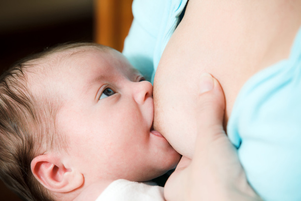 Mother breast feeding newborn baby - 写真・画像