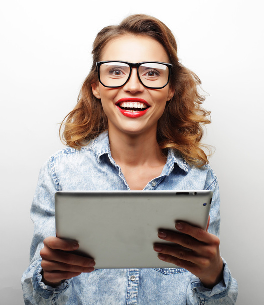 happy teenage girl wearing glasses with tablet pc computer - Foto, afbeelding